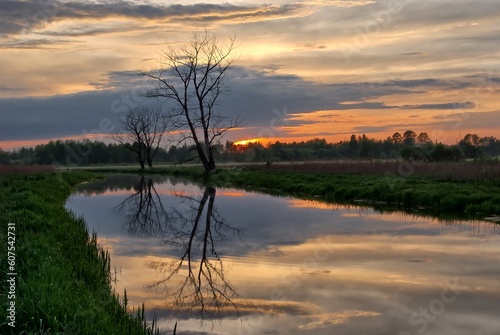 sunset over the river, in Poland