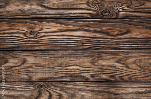 Old brown wooden background from dark natural wood in grunge style. View from above. natural planed texture