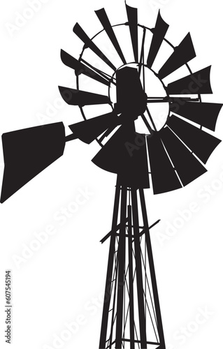 Silhouette of a water pumping windmill as might be seen on a farm.