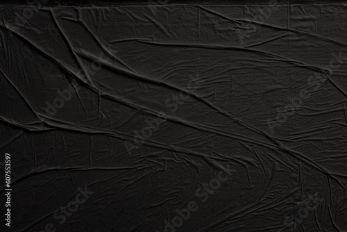 Empty crumpled wet black paper blank texture copy space wall background.