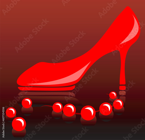 Red female shoe on a high heel and a beads on a white background.