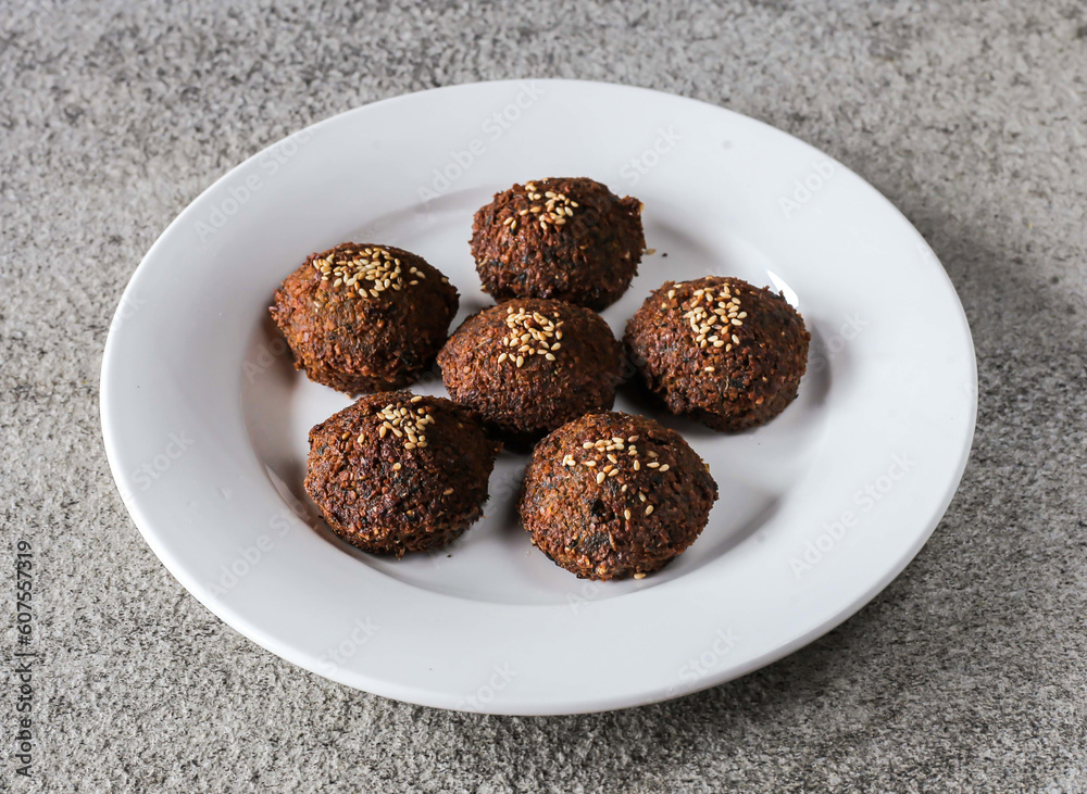 falafel plate with sesame seeds served in dish isolated on background top view of Arabic fast food falafel plate with sesame seeds served in dish isolated on background top view of Arabic fast food