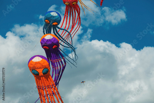 Huge octopus kites fly in the sky. The annual festival 
