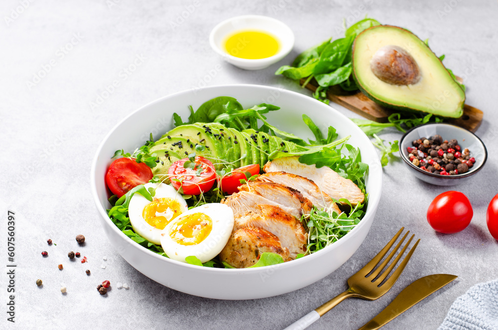 Grilled Chicken Fillet with Fresh Salad, Cherry Tomatoes, Boiled Egg and Avocado, Budha Bowl, Keto Paleo Diet Menu Grilled Chicken Fillet with Fresh Salad, Cherry Tomatoes, Boiled Egg and Avocado, Budha Bowl, Keto Paleo Diet Menu