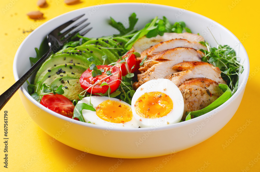 Grilled Chicken Fillet with Fresh Salad, Cherry Tomatoes, Boiled Egg and Avocado, Budha Bowl, Keto Paleo Diet Menu Grilled Chicken Fillet with Fresh Salad, Cherry Tomatoes, Boiled Egg and Avocado, Budha Bowl, Keto Paleo Diet Menu