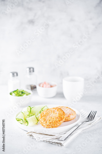 Shrimp patties with cucumber in a plate