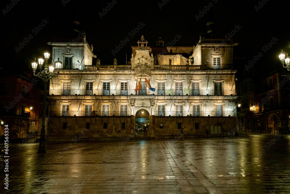 Stone building with beautiful old facade at Plaza Mayor in Leon at night, Spain
