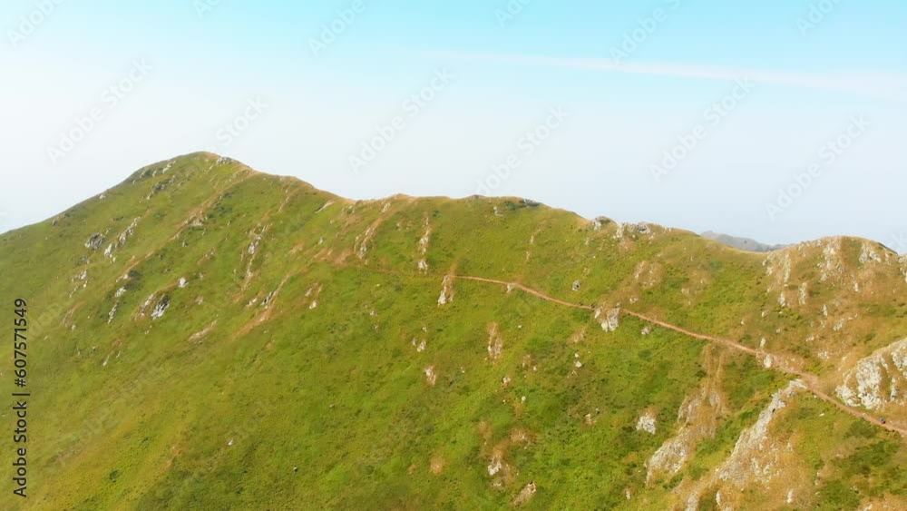 Aerial top view group of four hikers hike on Lagodekhi national park black rock trail back Aerial top view group of four hikers hike on Lagodekhi national park black rock trail back