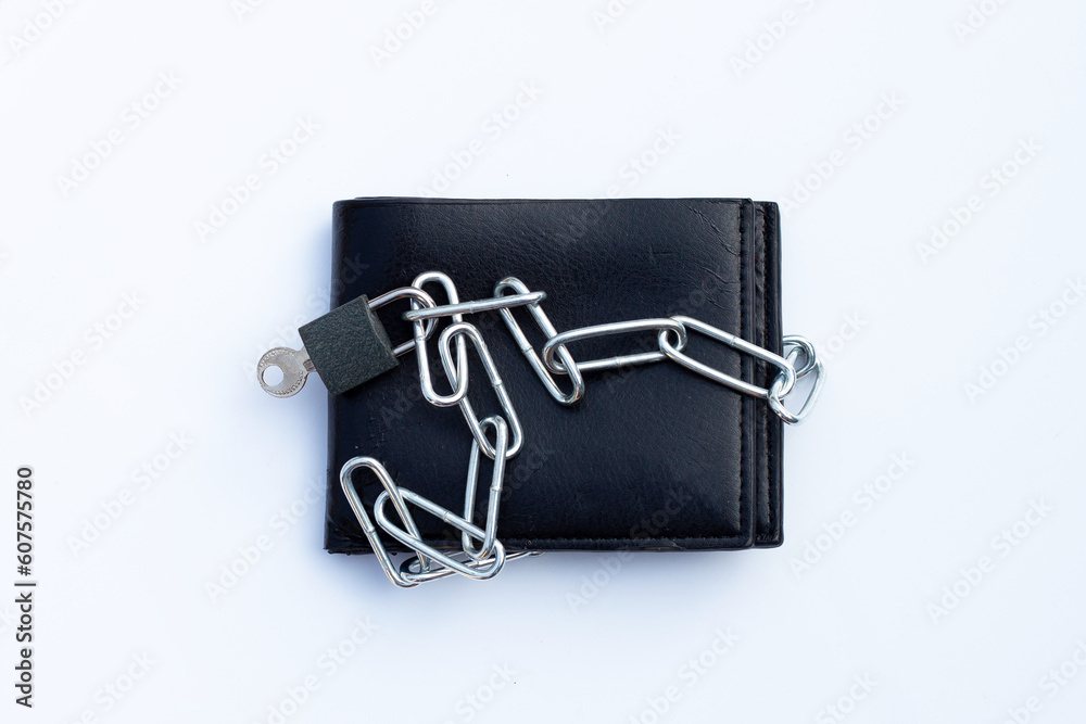 Black wallet in chains closed padlock on white background. Black wallet in chains closed padlock on white background.