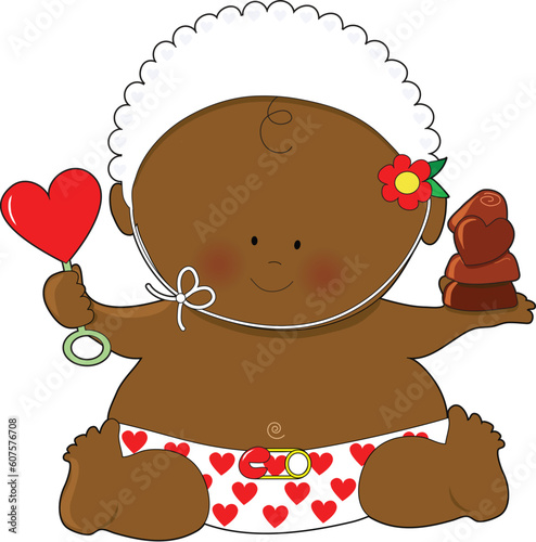 A cute baby holding a heart shaped rattle and some chocolates