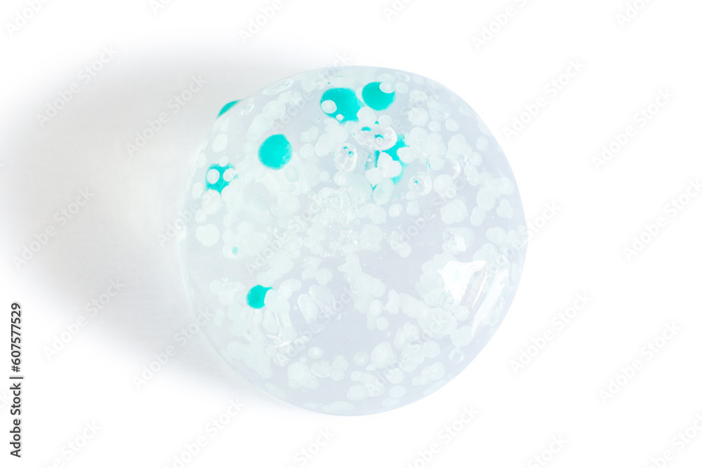 smears and drops of transparent gel with blue granules. On a white background. smears and drops of transparent gel with blue granules. On a white background.