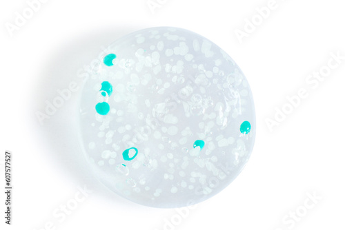 smears and drops of transparent gel with blue granules. On a white background.