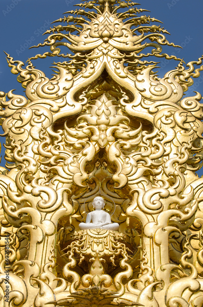 Detailed golden Buddha statue, with frame in White Temple. Thailand Chiang Rai - Wat Rong Khun