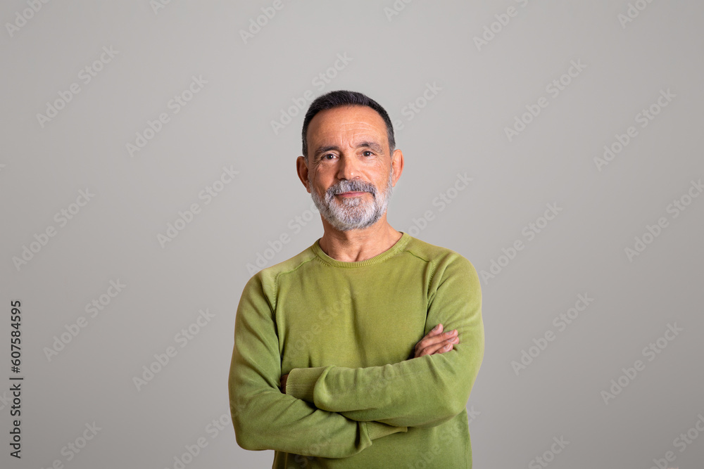 Happy confident old european man with crossed arms on chest look at camera isolated