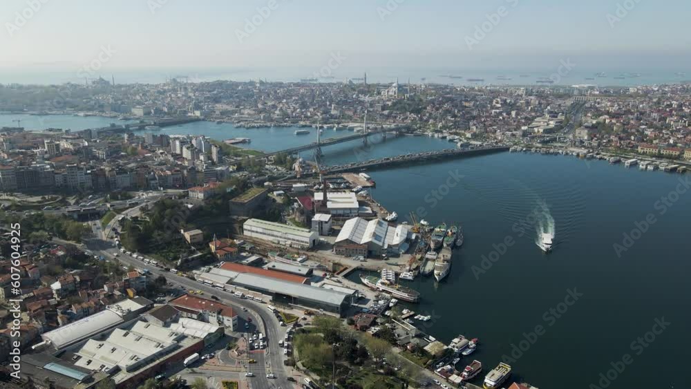 Aerial view of Beyoglu district along the Golden Horn river estuary with Galata bridge and the Ataturk bridge connecting Istanbul European Side, Turkey. Aerial view of Beyoglu district along the Golden Horn river estuary with Galata bridge and the Ataturk bridge connecting Istanbul European Side, Turkey.