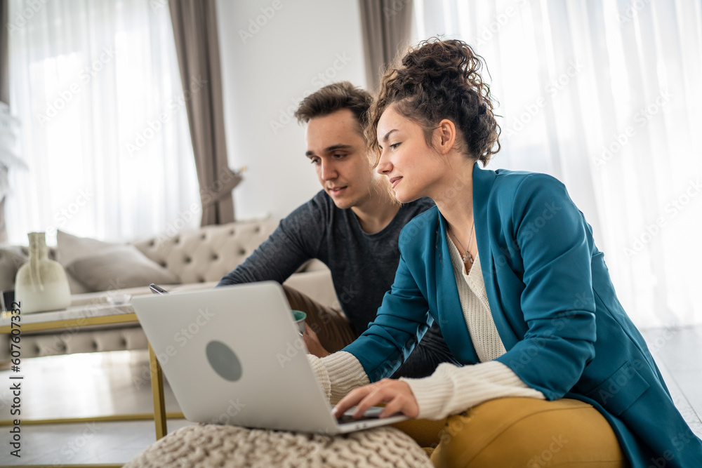 woman and man use laptop computer at home family work leisure concept woman and man use laptop computer at home family work leisure concept
