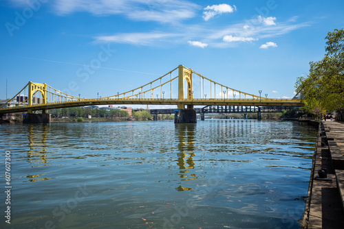 Rachel Carson bridge crossing Allegheny River in Pittsburgh, Pennsylvania, with raildroad bridge in the background.