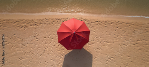 Red Beach Umbrella, Aerial Tranquility.  Red Beach Umbrella Atop a Pristine Sandy Beach, People-Free, and Magnificently Top View.  Generative AI.  