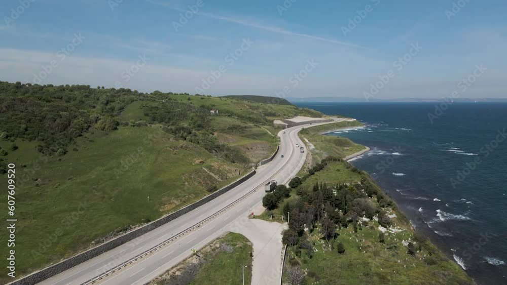 Aerial view of a serpentine road following the coastline along the Marmara Sea, Sevketiye, Lapseki, Turkey. Aerial view of a serpentine road following the coastline along the Marmara Sea, Sevketiye, Lapseki, Turkey.