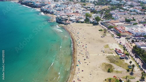 Aerial view of people on Playa de San Jose, a public beach in summer, Almeria, Spain.