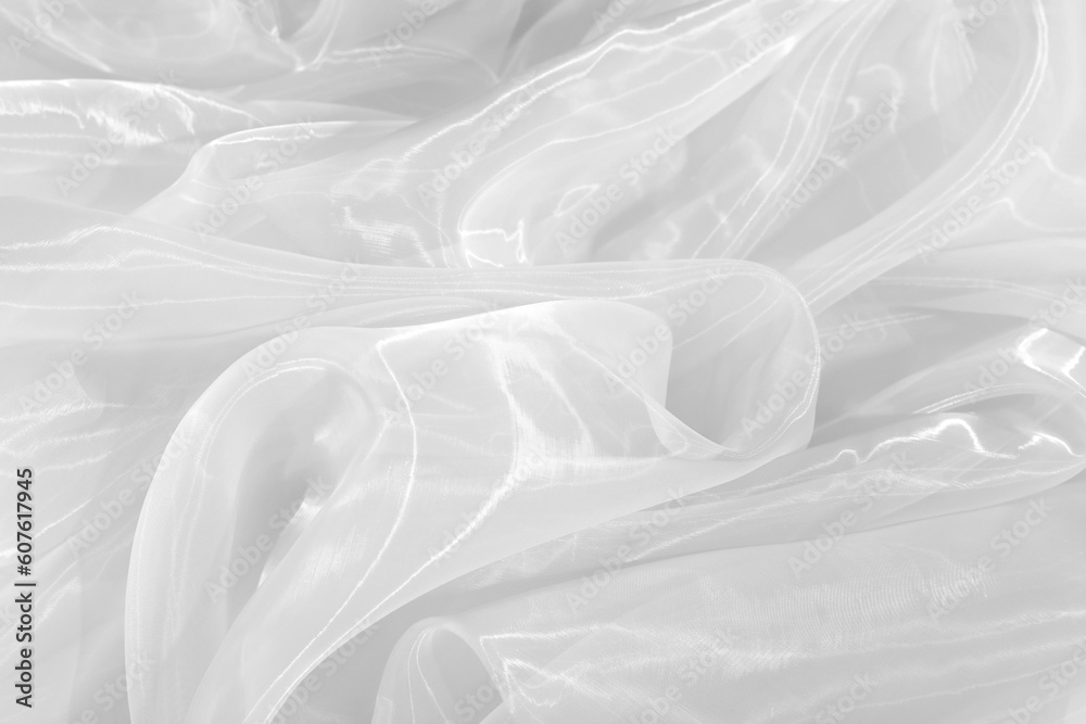 Fototapeta premium White tulle fabric as background, closeup view