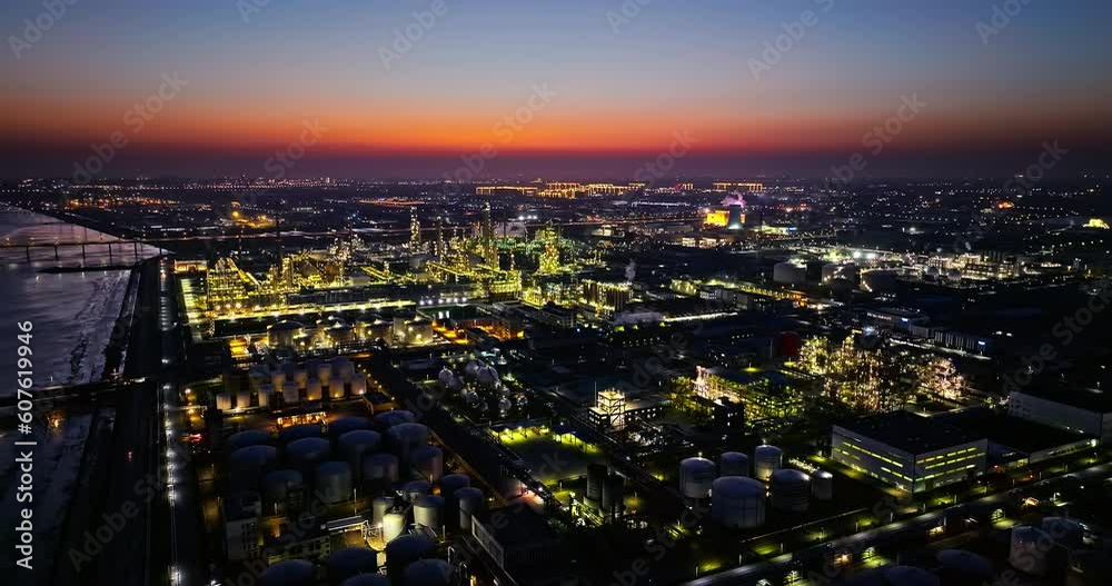 Aerial view of oil and gas petrochemical industrial with Refinery factory. industrial area buildings scenery at night. Aerial view of oil and gas petrochemical industrial with Refinery factory. industrial area buildings scenery at night.