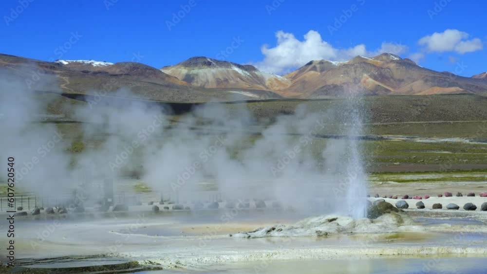 Hot Steam and Water at El Tatio Geyser, with Colorful Mountains in Background. Hot Steam and Water at El Tatio Geyser, with Colorful Mountains in Background.