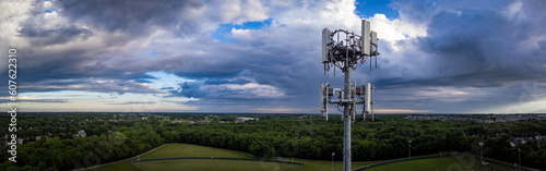 Drone view of telecommunication equipment on top of tall repeater tower located on the outskirts of midwest American city of Lexington, Kentucky photo