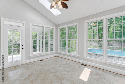Open Plan Modern Sun Room in Summer with Skylights and Pool View