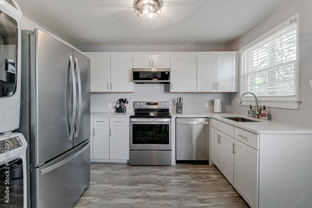 Minimal Clean Modern Kitchen Interior with White Cabinets in Spring Minimal Clean Modern Kitchen Interior with White Cabinets in Spring