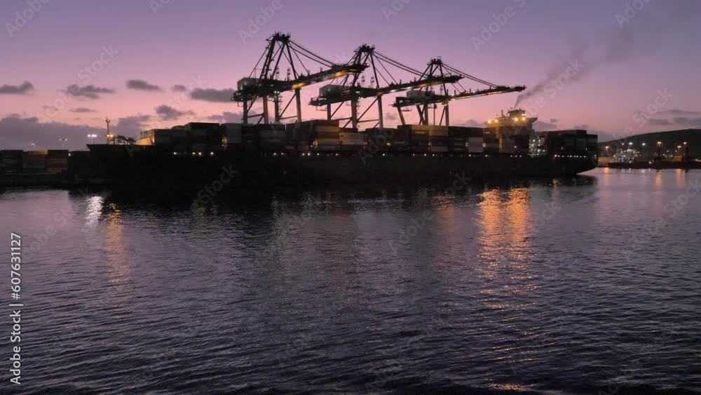 Cargo ship loading in port - twilight time. Ensenada - Mexico. Cargo ship loading in port - twilight time. Ensenada - Mexico.