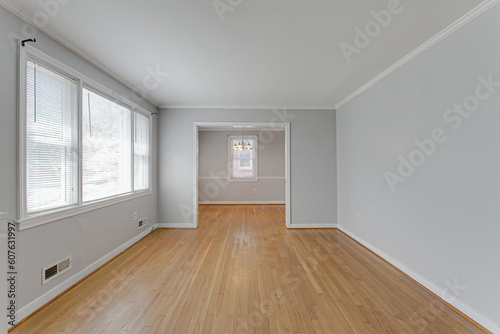 Empty Modern Living Room Interior with Hardwood Floors and Grey Walls