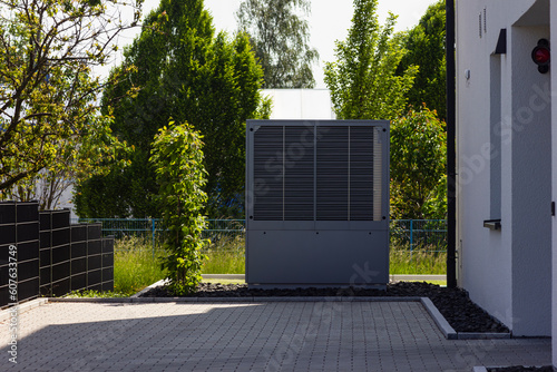heat pump in a new building area with modern house facades