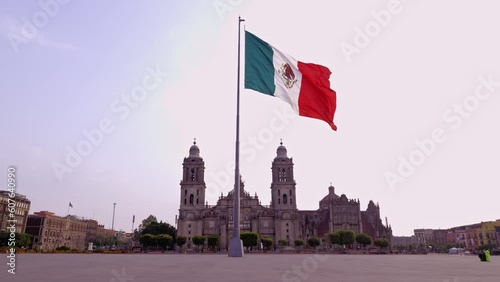 Flag of mexico waving with the metropolitan cathedral in the background, Mexico City downtown. 4k video photo