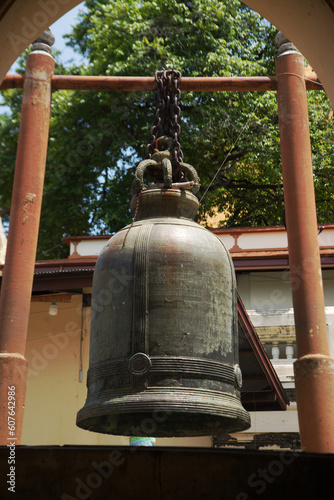 Large metal bell Hang it for Buddhists all over Thailand. Knock or hit for good luck and decorated at Wat Phra Pathom Chedi. Located at Nakhon Pathom Province in Middle of Thailand.