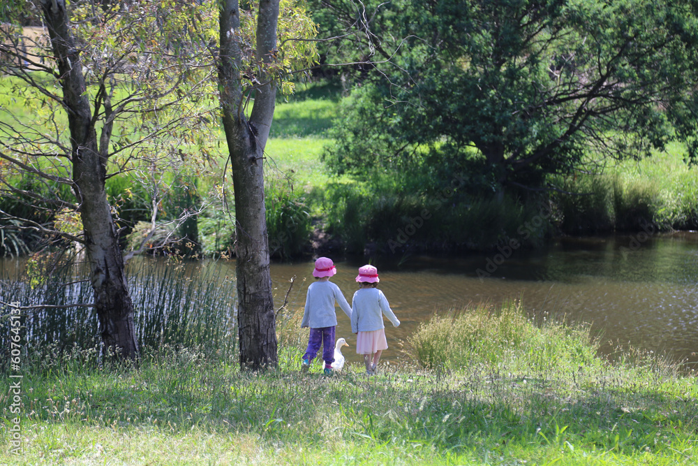 Fototapeta premium Children in the park with a duck
