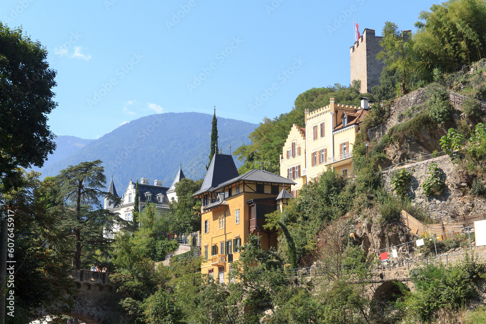 Panorama view of Powder Tower above Merano, villa mansions and mountains in South Tyrol, Italy