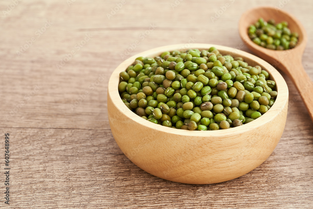 green mung bean vigna radiata in wood bowl on table food background. green mung bean vigna radiata. green mung bean vigna radiata isolated food background green mung bean vigna radiata in wood bowl on table food background. green mung bean vigna radiata. green mung bean vigna radiata isolated food background
