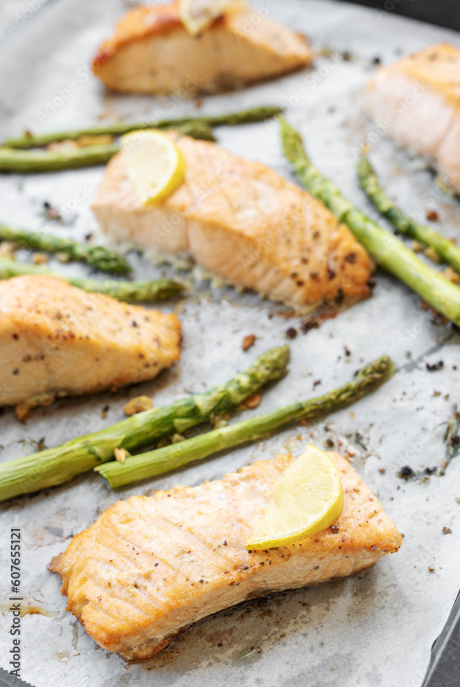 Baked Delicious salmon, green asparagus and lemon in pan