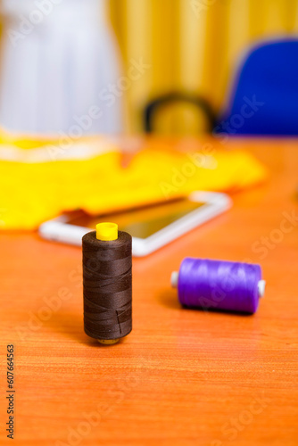 Colorful thread spool on the desk