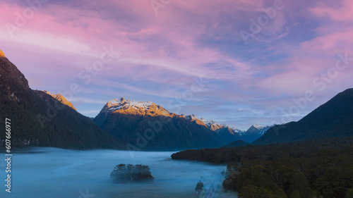 The Road trip view of travel with mountain view of autumn scene and foggy in the morning with sunrise sky scene at fiordland national park