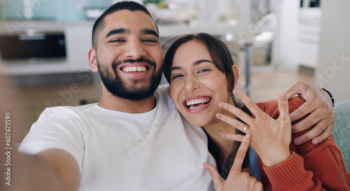 Couple, selfie and engagement ring in living room portrait for happiness, romance and love on social media app. Man, woman and excited for marriage proposal, offer and celebration with smile on blog