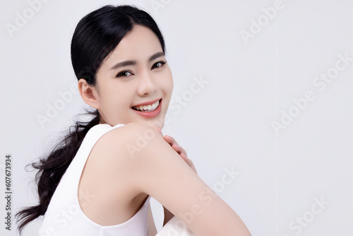 Close up portrait smooth and clean face of young Asian woman isolated on background with natural make up. Cosmetic advertising concept.