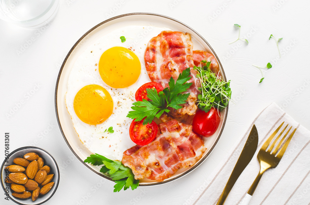 Fried Eggs and Bacon with Cherry Tomatoes on Plate, Breakfast, Keto, Paleo Diet Lunch Fried Eggs and Bacon with Cherry Tomatoes on Plate, Breakfast, Keto, Paleo Diet Lunch