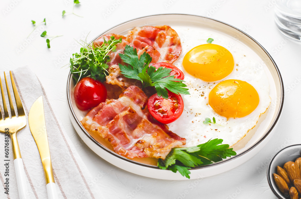 Fried Eggs and Bacon with Cherry Tomatoes on Plate, Breakfast, Keto, Paleo Diet Lunch Fried Eggs and Bacon with Cherry Tomatoes on Plate, Breakfast, Keto, Paleo Diet Lunch