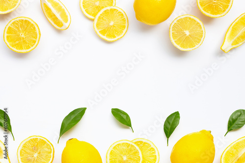 Frame made of lemon with leaves on white background. Copy space