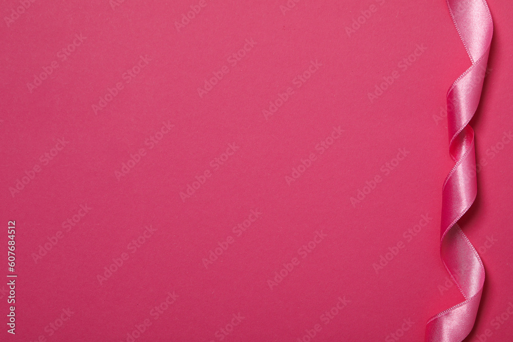 Concept of different ribbons, pink ribbon on pink background Concept of different ribbons, pink ribbon on pink background