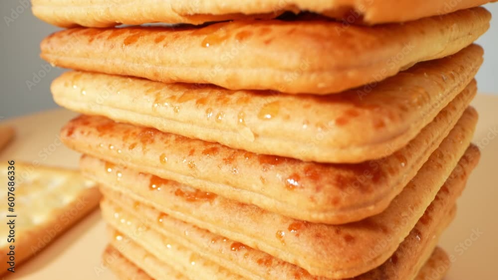 Captivated by the sight of sugar-coated biscuits in this stunning macro video, showcasing their flawless textures and the delicate balance between the sugary coating and the buttery biscuit beneath.
