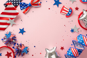 USA Liberty Day celebration. Top view of symbolic decor, party serpents, shiny stars, glitter confetti, headbands, tie, bow-tie on pastel pink background with empty frame for text or promo