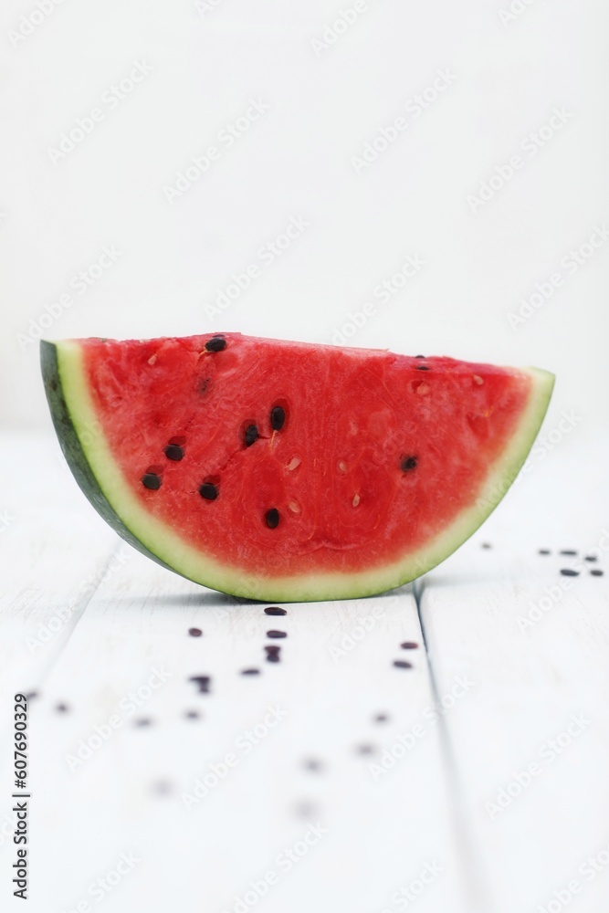 A piece of watermelon, on the table, food, snack, dessert, background A piece of watermelon, on the table, food, snack, dessert, background